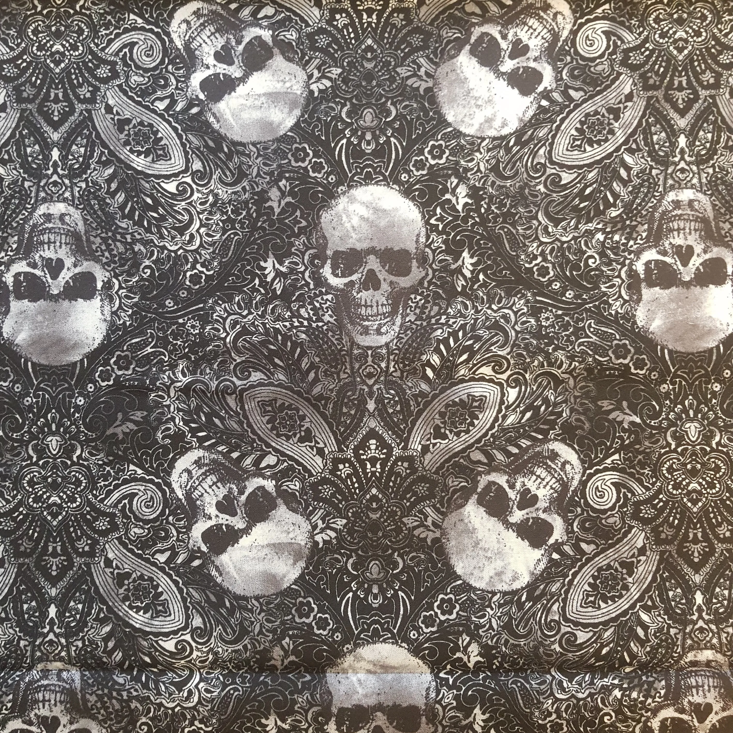 Timeless Treasures Silver Skulls and Swirls on Black Background Cotton Fabric.